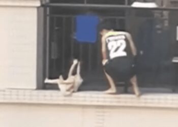 Video Shows Child Dangling From Balcony Before Being Rescued By Neighbor