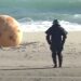 Mysterious Metal Sphere Causes Confusion After Washing Ashore in Japan